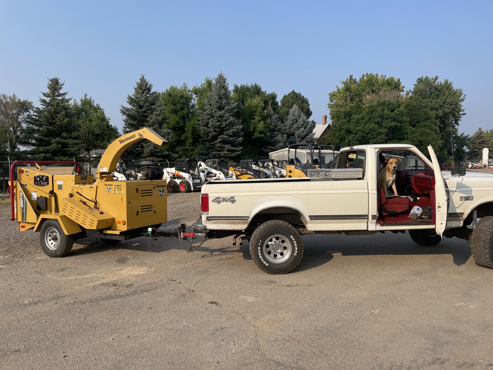 Boulder Tree Surgeon truck and Vermeer chipper rig at a job site