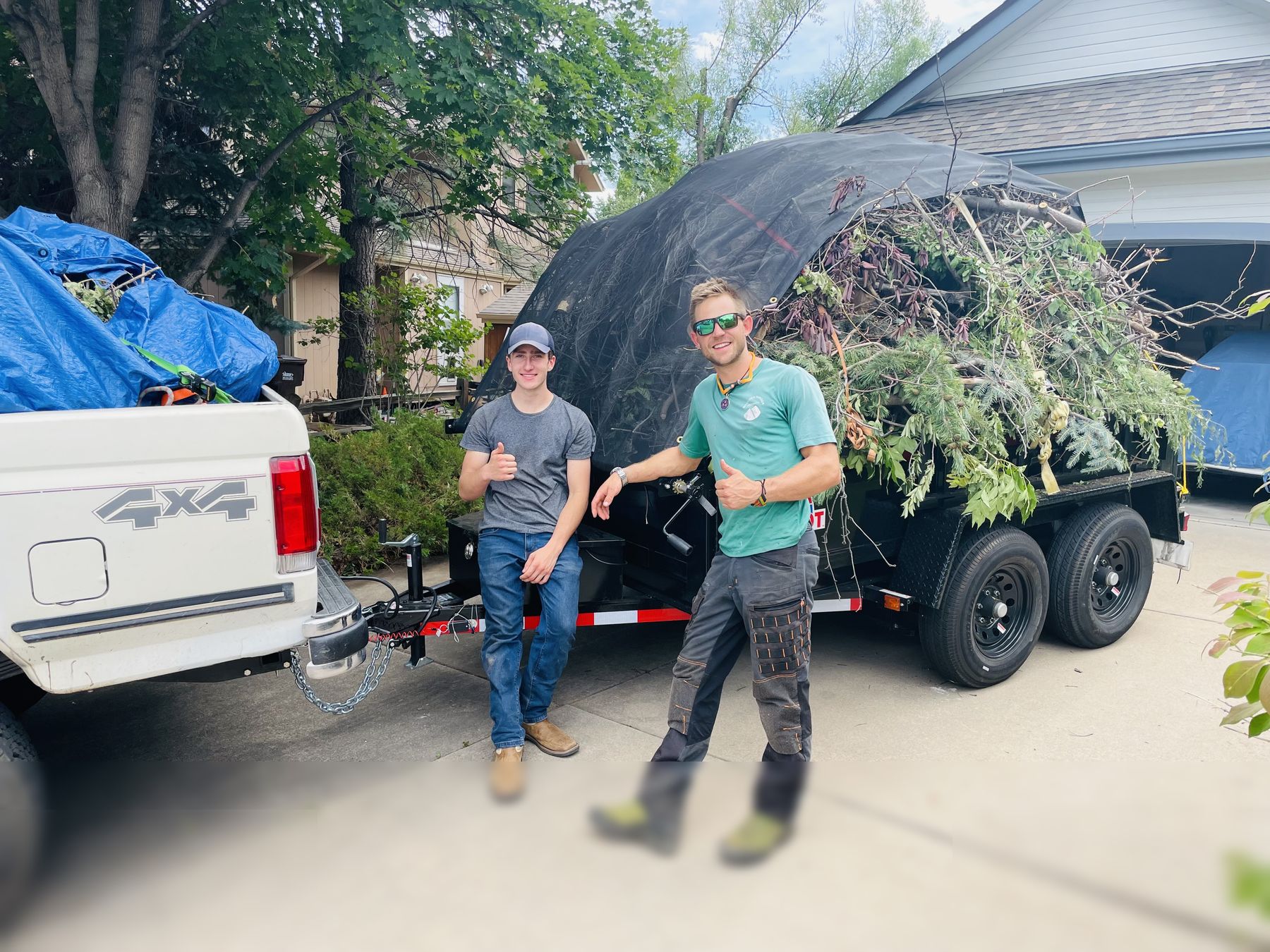 Boulder Tree Surgeon crew with a loaded brush trailer in Erie, CO